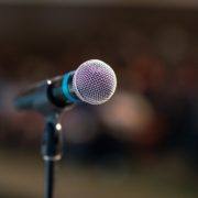 an image of a microphone before someone does a speech