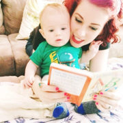 An adult and baby playing speech games at home