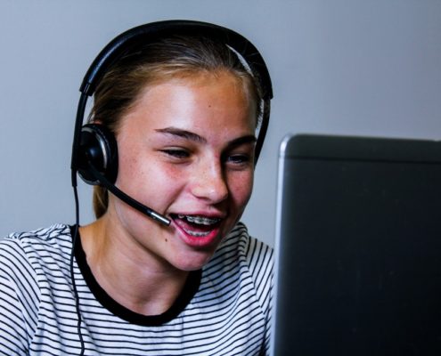 Girl doing speech therapy at school