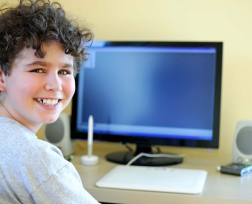 Child doing online speech therapy as opposed to in person