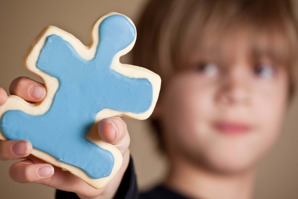 child with autism doing a puzzle