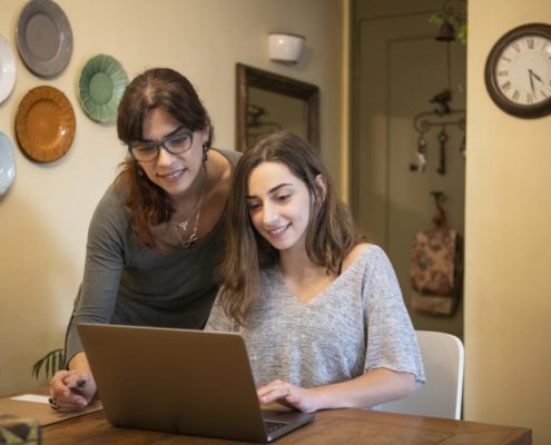 a mother helping a child that has ADHD