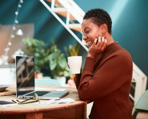 a woman with a stutter on her laptop