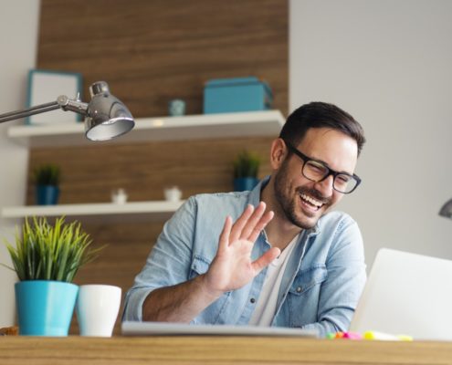 a man with TBI taking online speech therapy