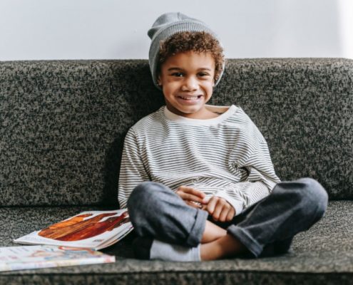 child sitting on a couch