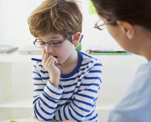 child with a speech therapist