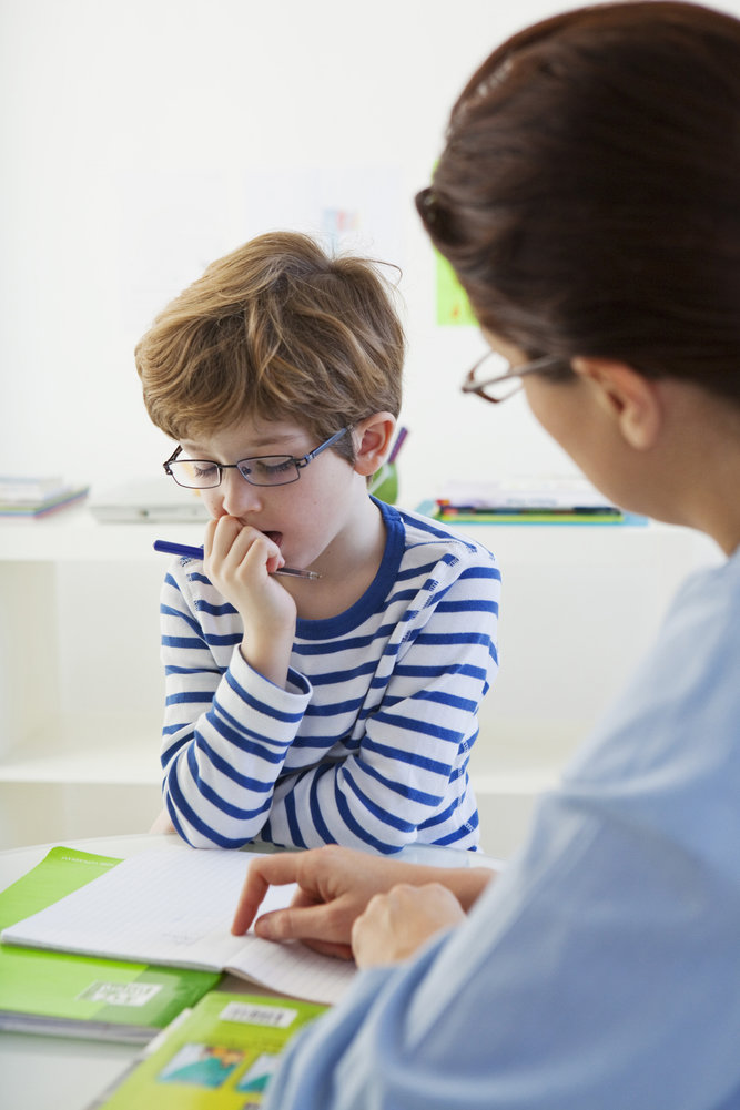 child with a speech therapist