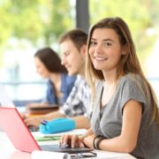 a woman on a laptop doing Reading Comprehension for Adults