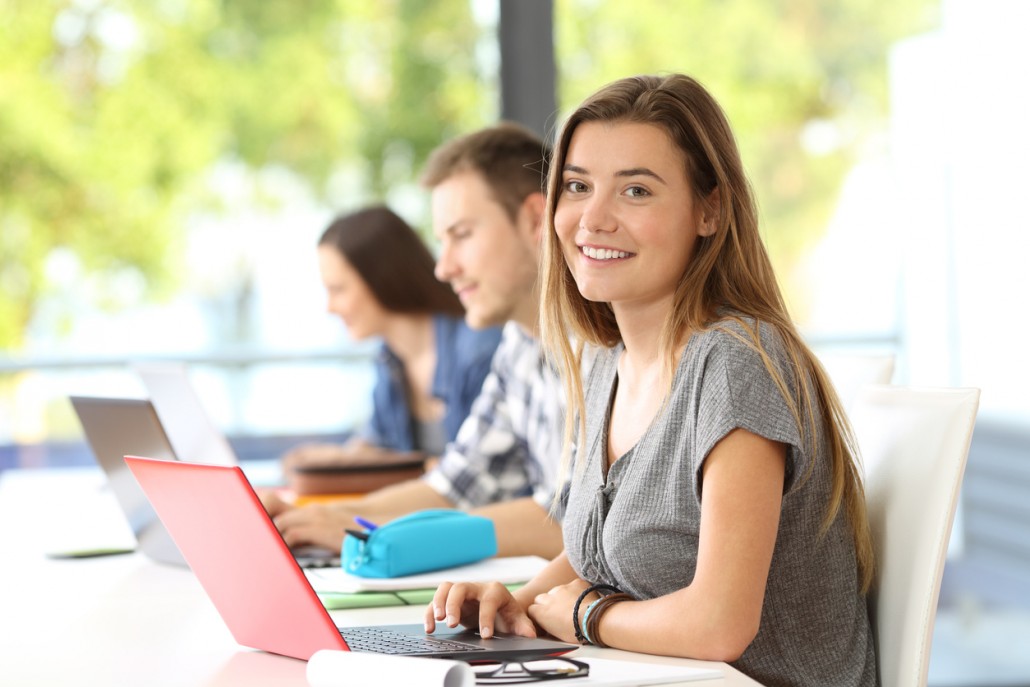 a woman on a laptop doing Reading Comprehension for Adults