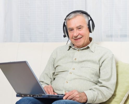 a stroke victim at home on a laptop getting help