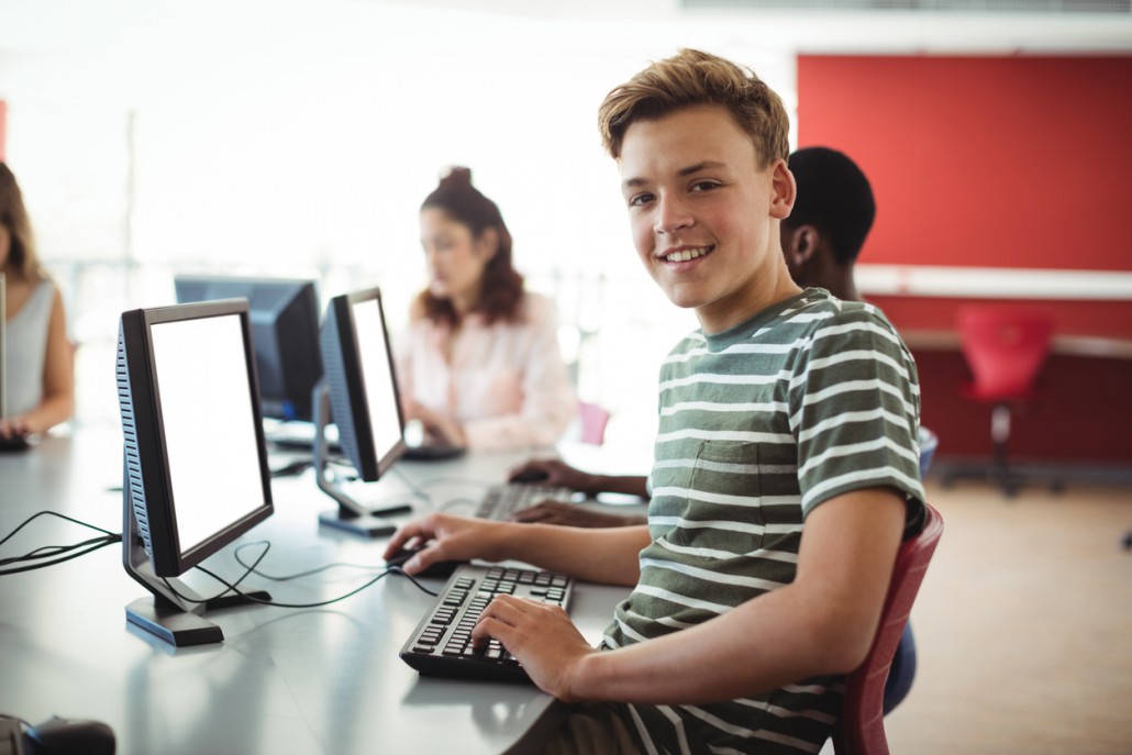 a young man on his school computer