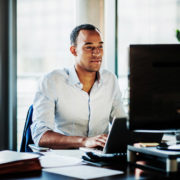 a man with ADHD on his computer