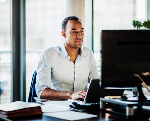 a man with ADHD on his computer