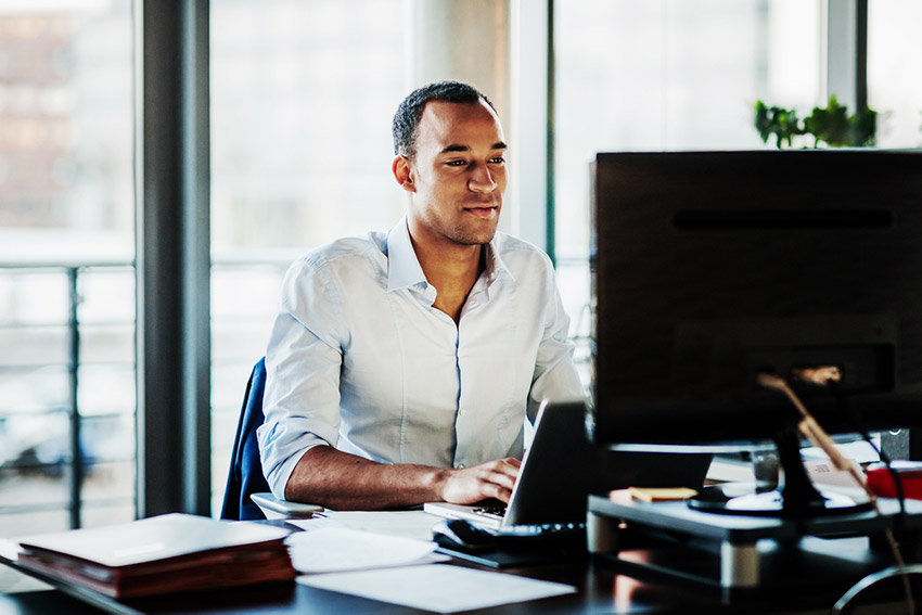 a man with ADHD on his computer