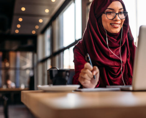 a woman taking an online class to reduce her accent