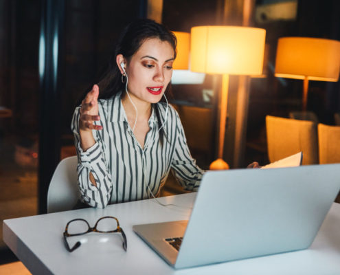 An adult on a laptop learning about the Most Common Types of Voice Disorders