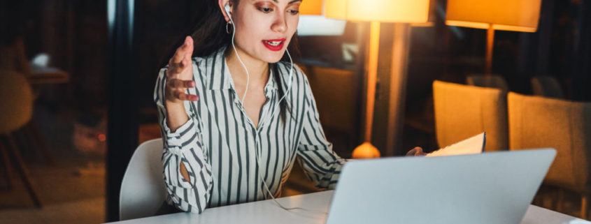 An adult on a laptop learning about the Most Common Types of Voice Disorders