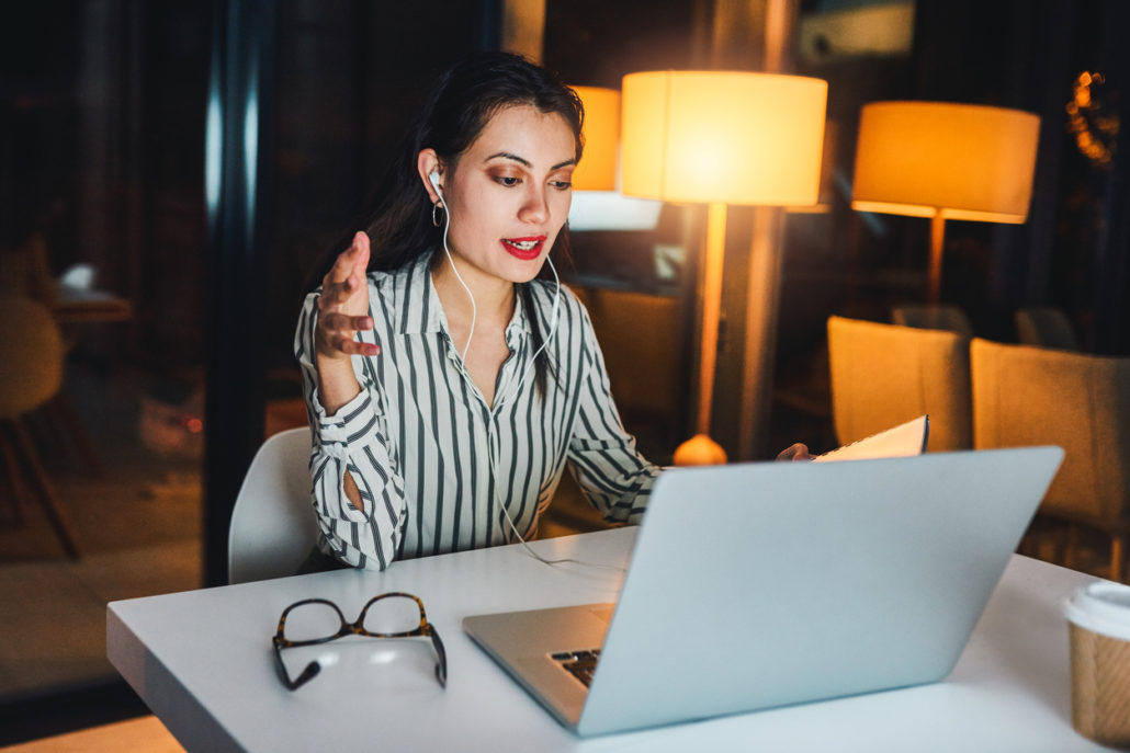 An adult on a laptop learning about the Most Common Types of Voice Disorders