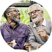 Two older man talking and laughing representing Reclaim lost skills, quality of life, or independence.