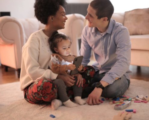 parents with their child who just said dada for the first time