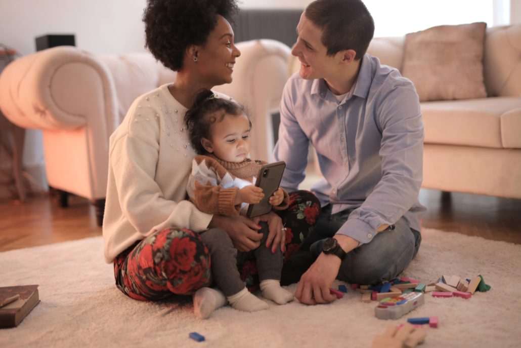 parents with their child who just said dada for the first time