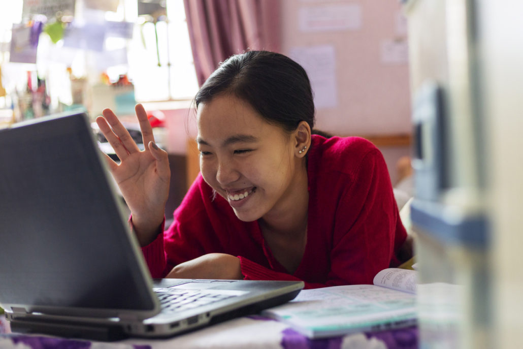 a woman with signs of traumatic brain injury on her laptop