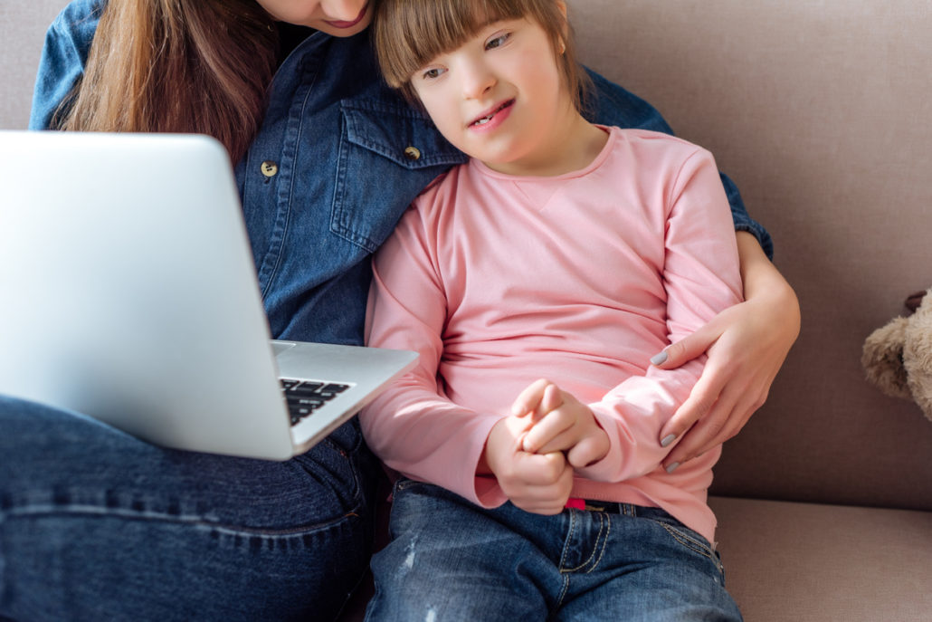 a child at home working on her communication skills through online learning