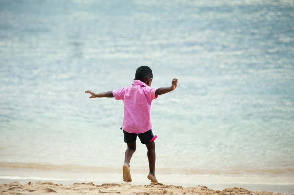 a child at the beach doing speech therapy during the holidays