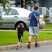 father and son communicating while jogging