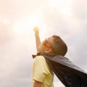 child dresses as a superhero