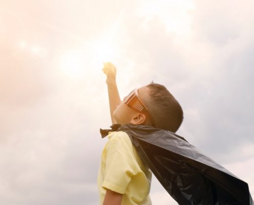 child dresses as a superhero