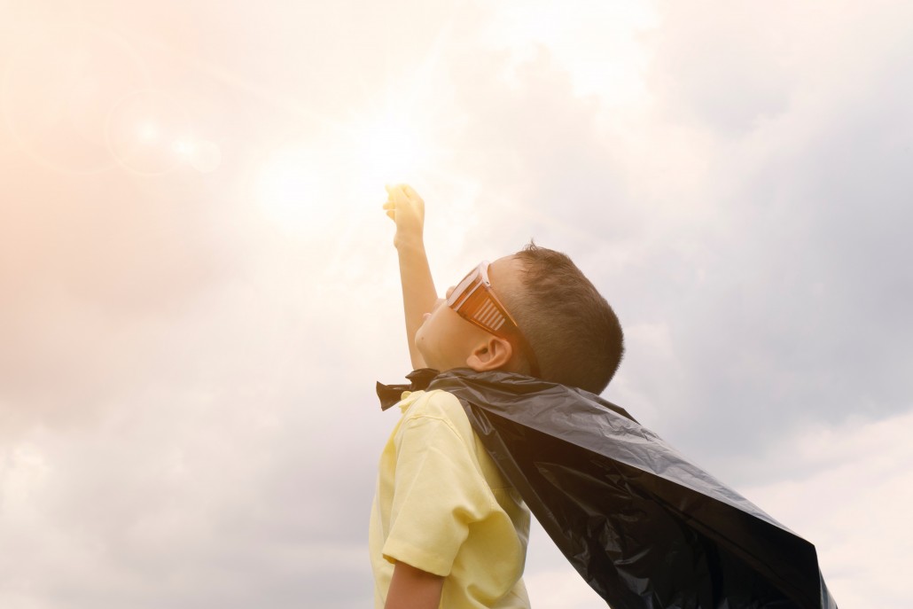 child dresses as a superhero