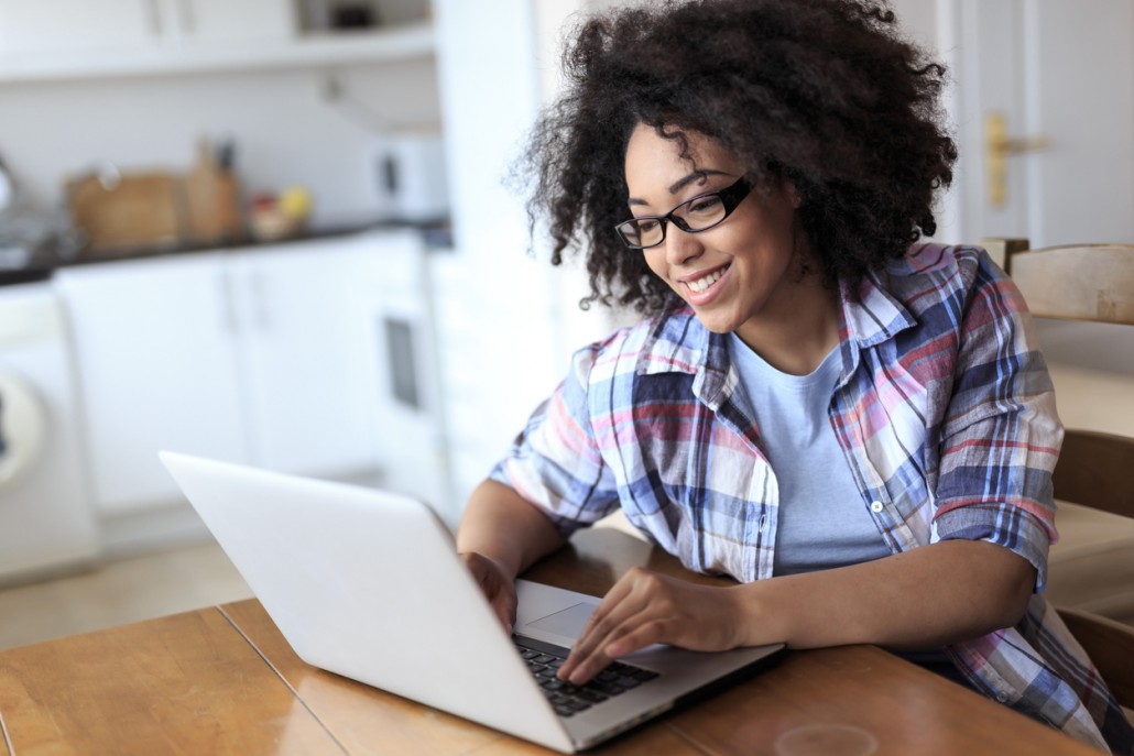 woman at home on her laptop researching