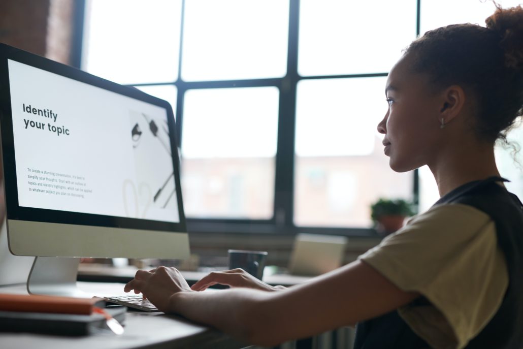 young girl on a laptop at home researching