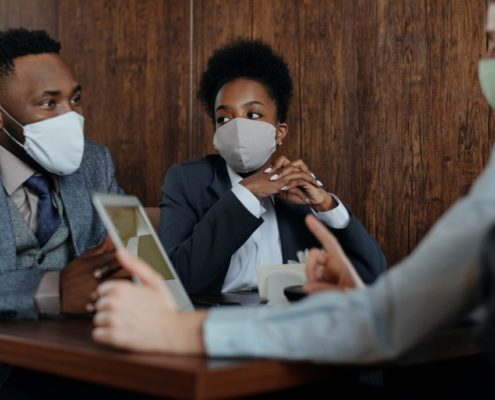 a couple with masks on learning about vocal hygiene