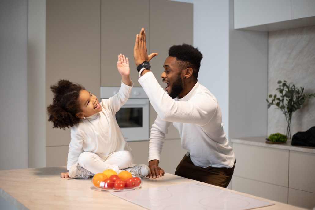 father with his 3 year old daughter practicing speech