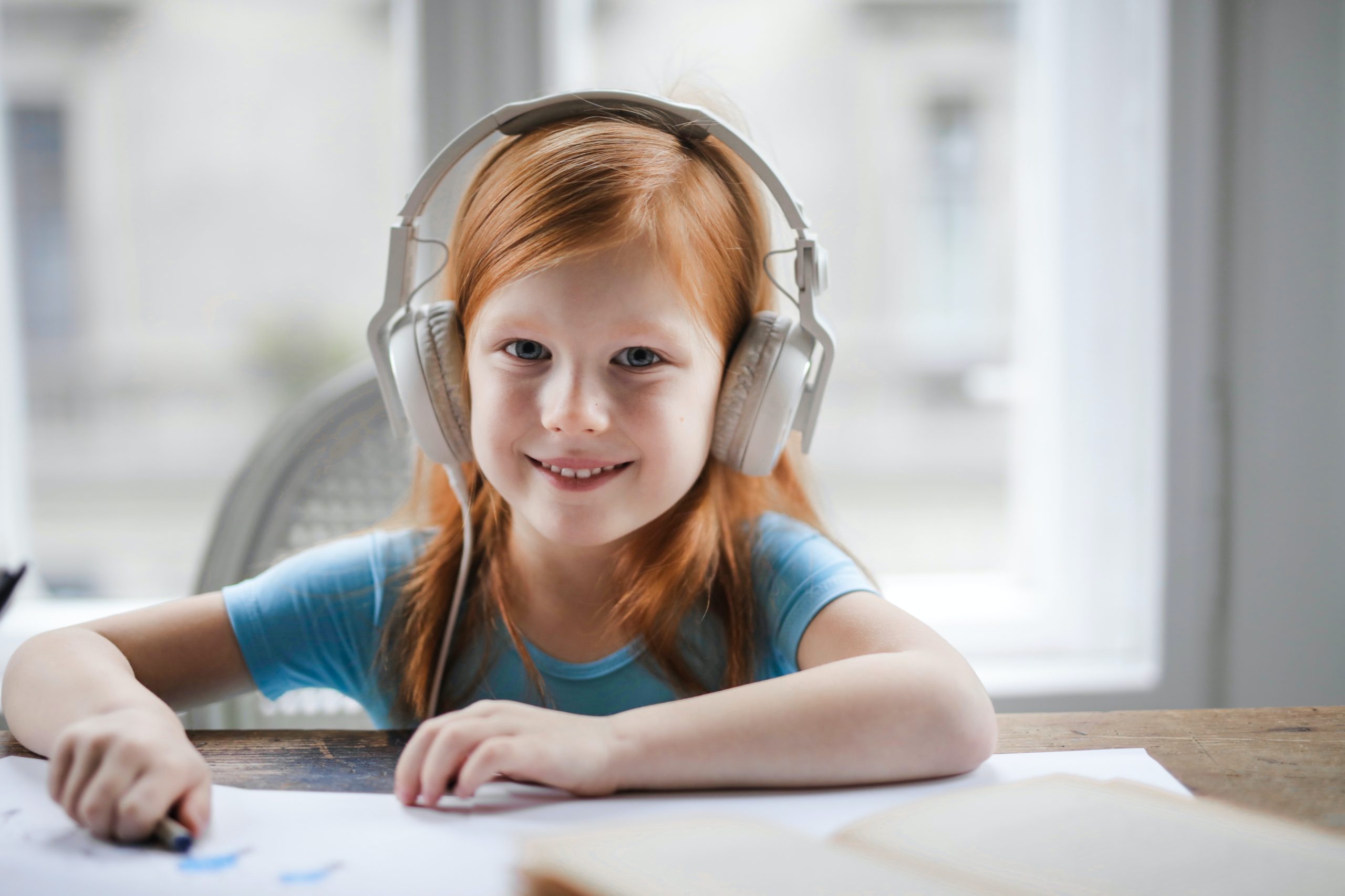 A child at home doing PROMPT therapy on her laptop