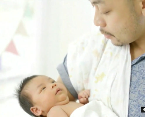 a man holding a baby
