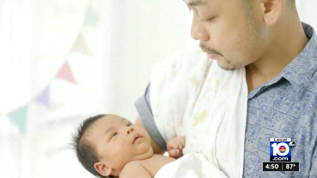 a man holding a baby