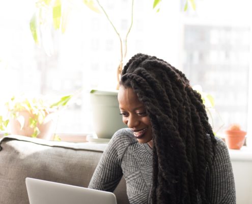 An adult doing online speech therapy at home