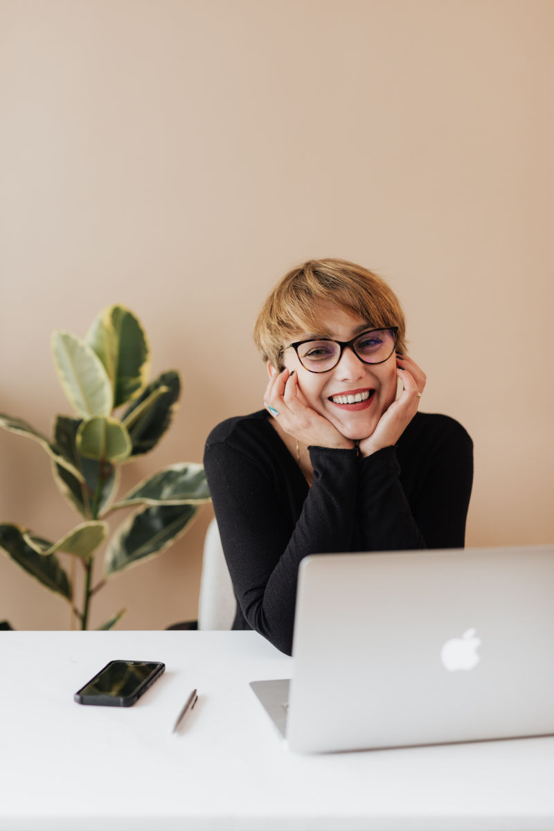 woman at home on her computer learning about social communication