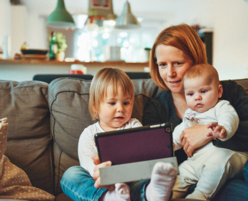 a mother with her kids at home practicing speech