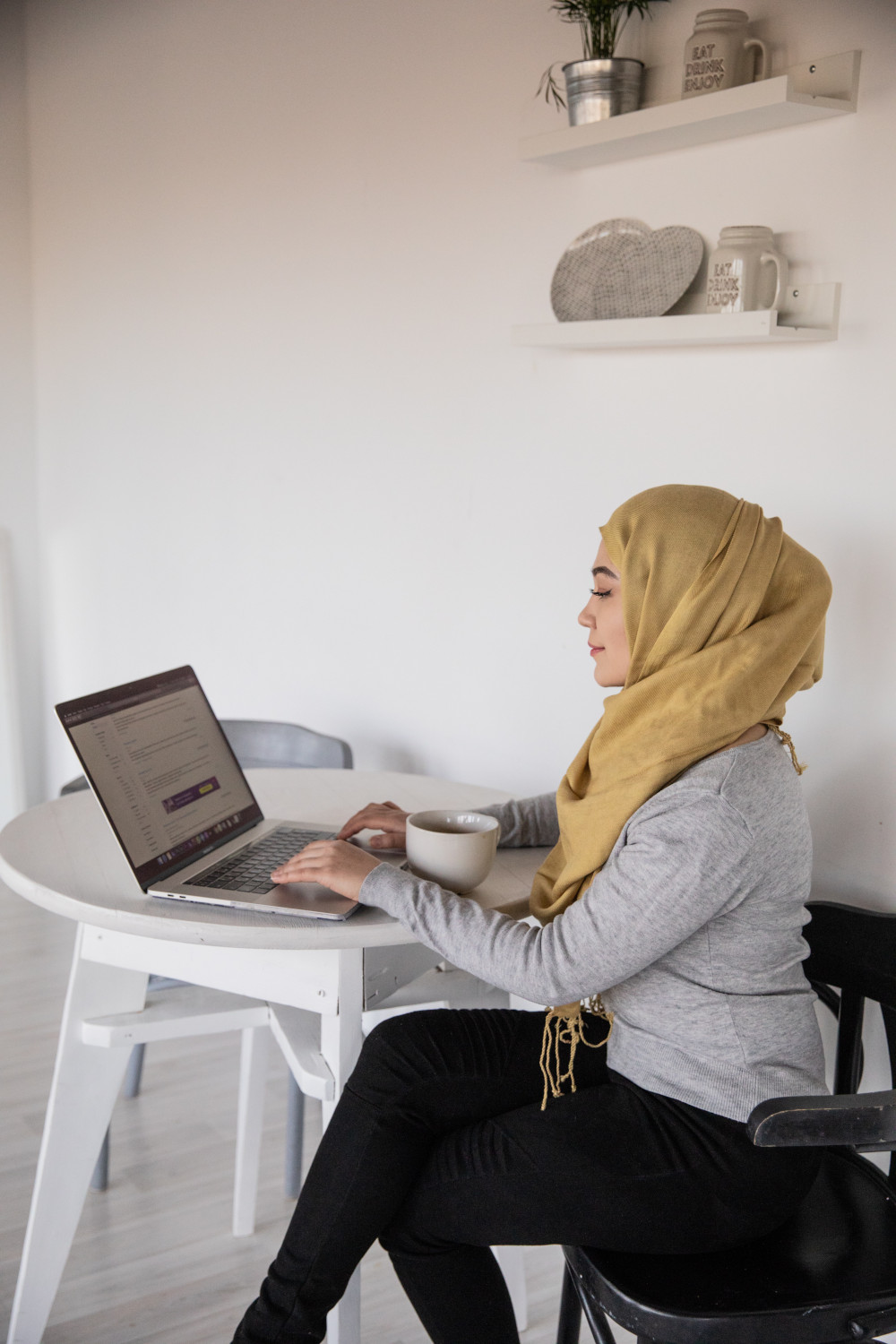 a woman at home doing online speech therapy for dysarthria