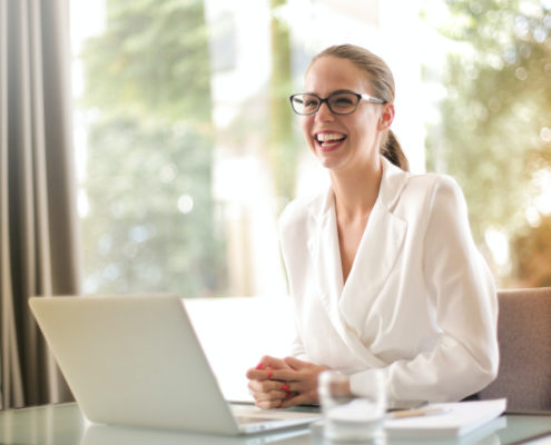 a woman with aphasia at home on a laptop
