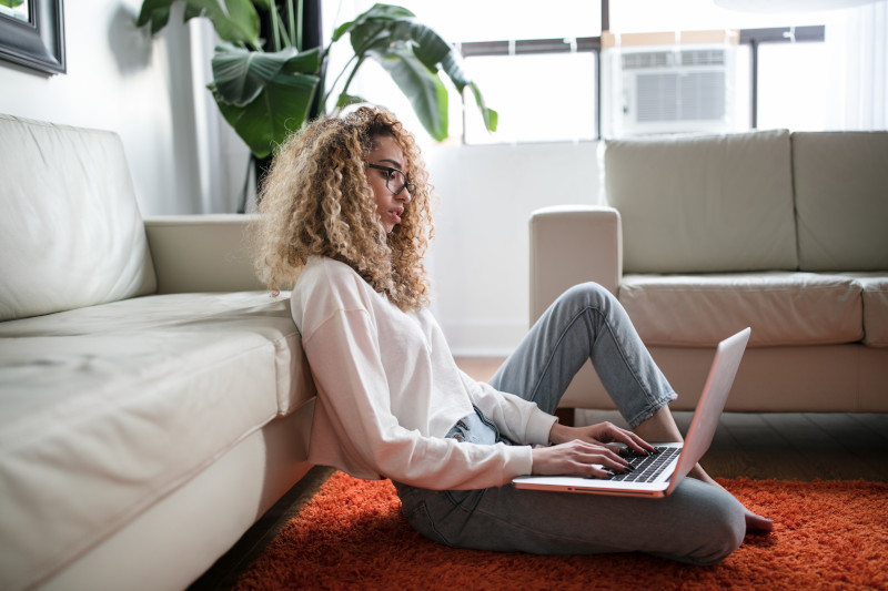 a woman at home on her laptop suffering anxiety