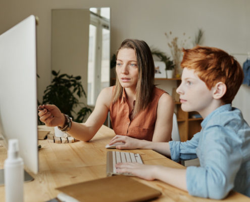 child learning at home on the computer