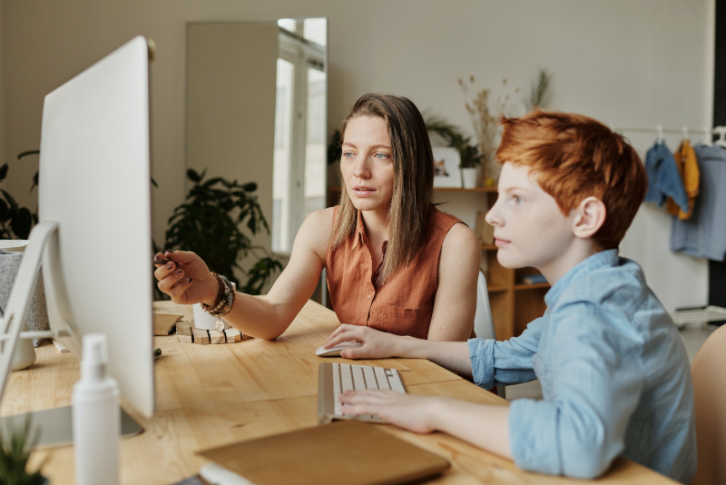 child learning at home on the computer