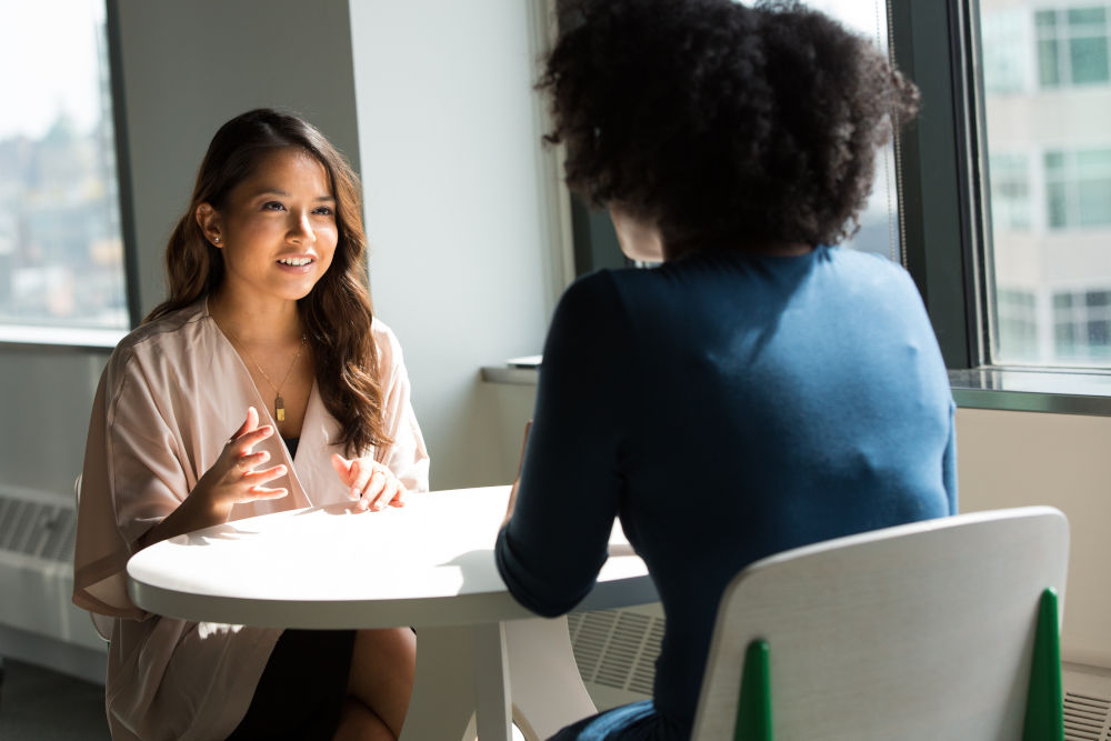 two women discussing stress