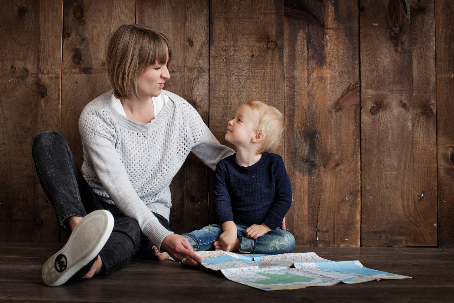 a mother reading to her young child