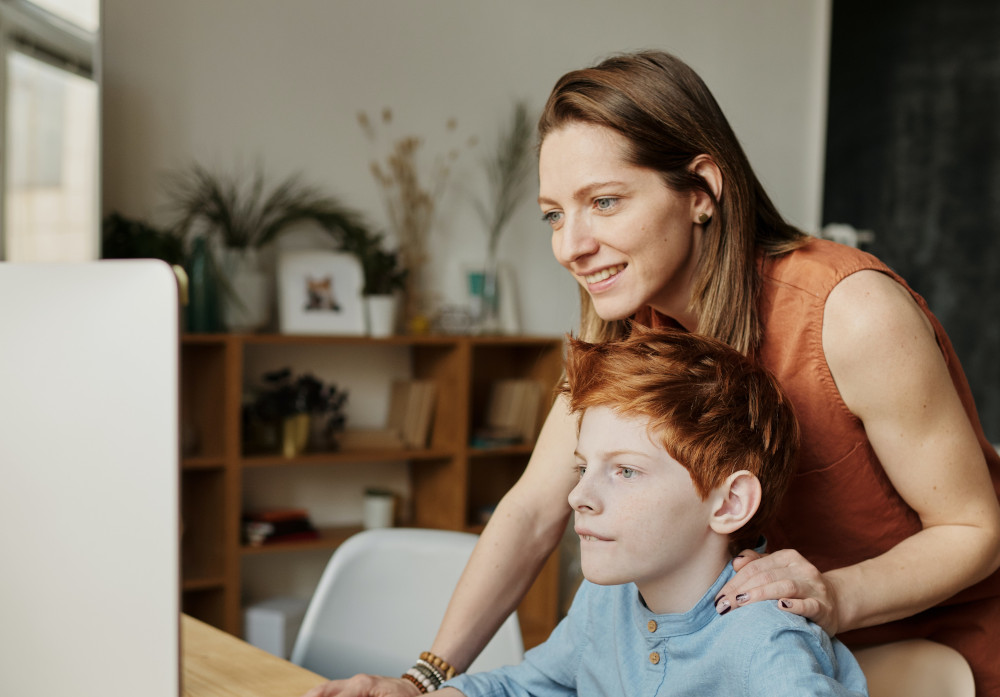 mother helping her son with his communication